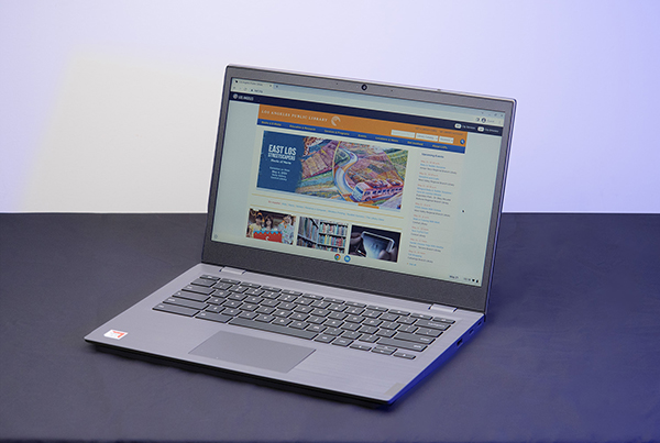 photo of a laptop computer open on a tabletop, displaying the los angeles public library website