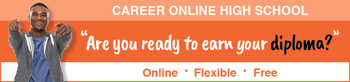 Student pointing at a screen with a smile