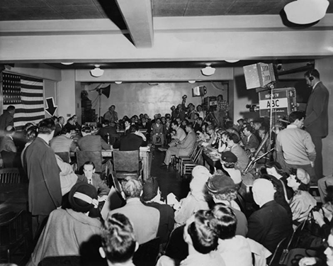 March 23, 1953, in the Los Angeles Federal Building, with KECA-TV crew and Herald Express reporters in attendance