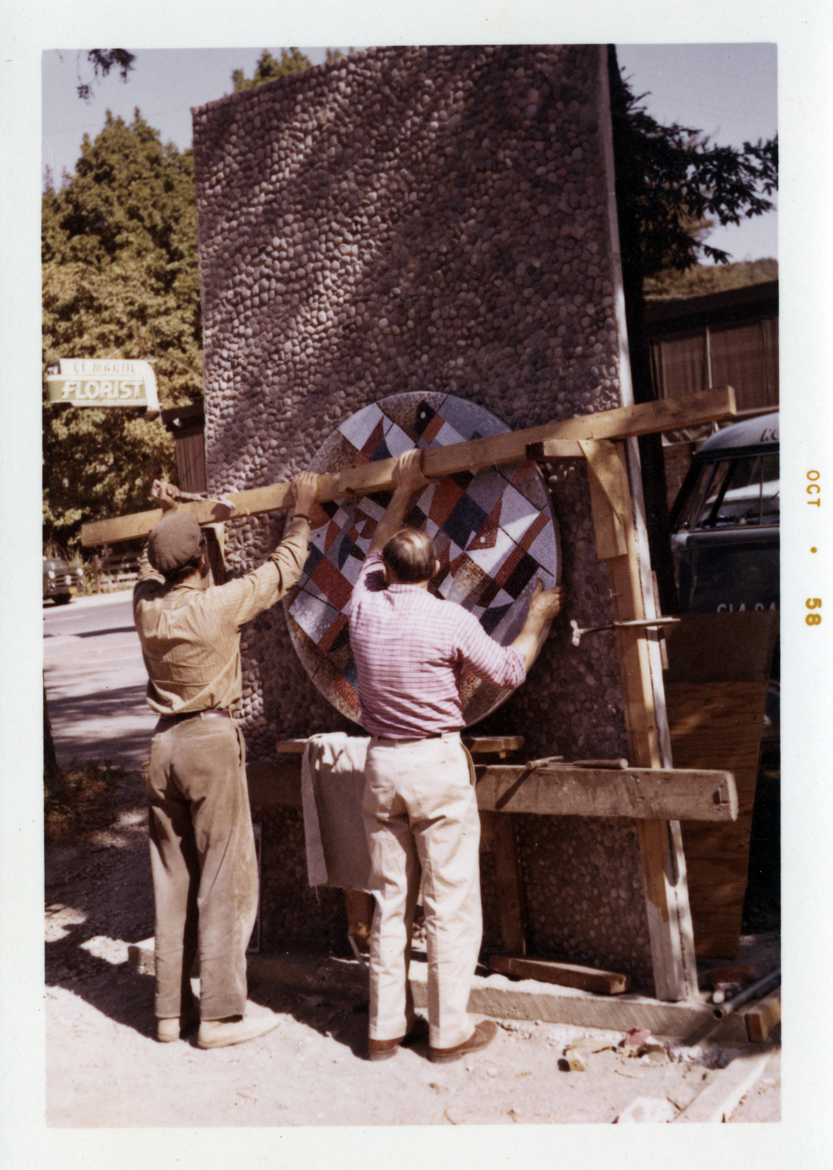crew putting togehter mural