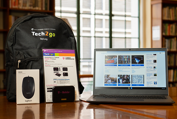 Items in a computer bundle including a Chromebook, a hotspot, a computer mouse, and a black backpack