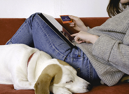 close up of hand holding a library card